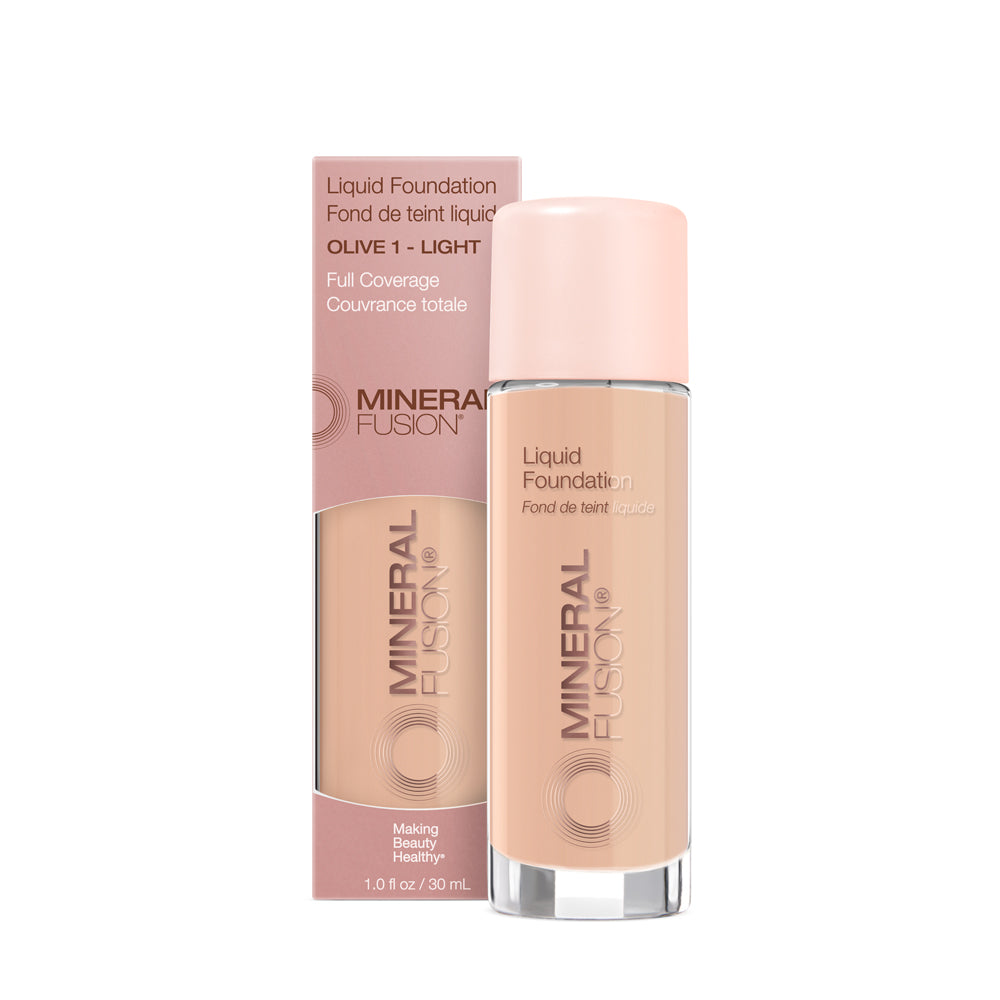 A pump bottle of liquid foundation branded 'Mineral Fusion' with its packaging box behind it. The foundation is displayed in a shade close to fair to medium skin tone range.