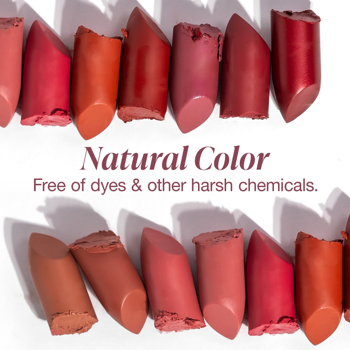 Row of red lipsticks with a white background and text about natural color.
