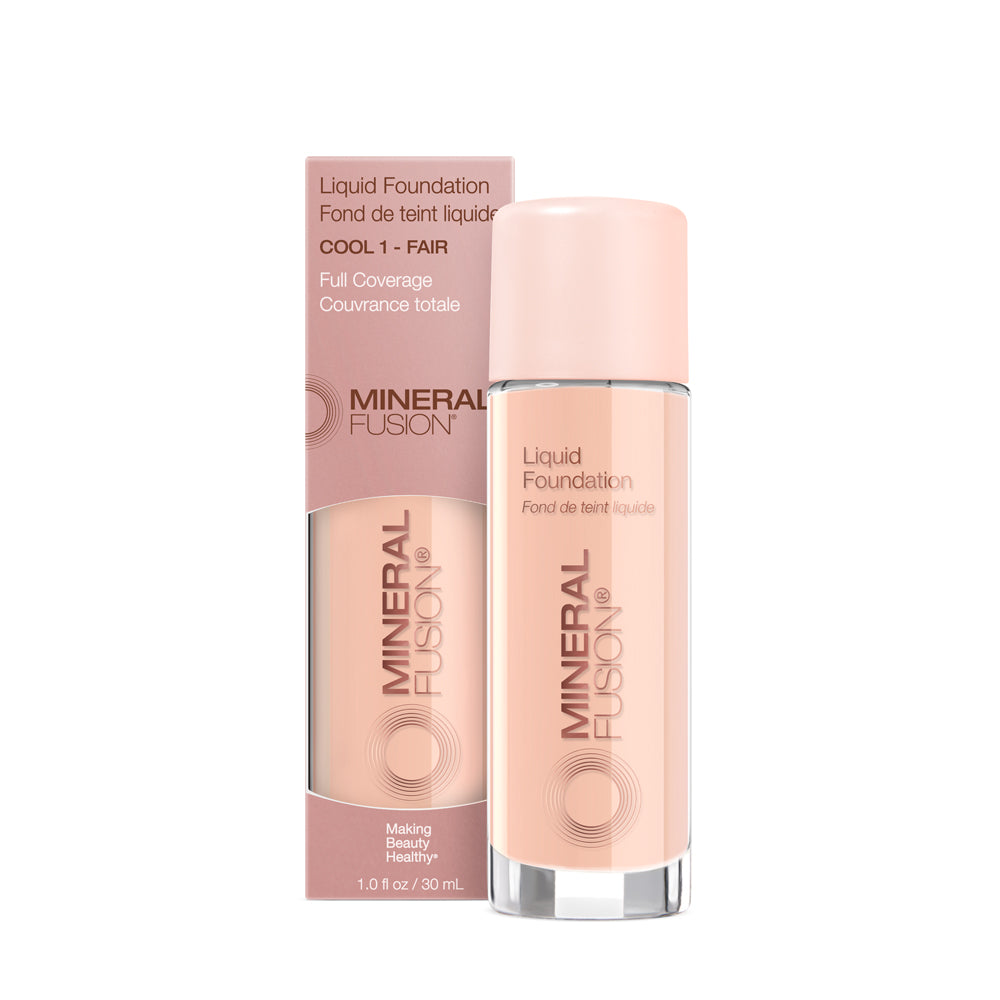 A pump bottle of liquid foundation branded 'Mineral Fusion' with its packaging box behind it. The foundation is displayed in a shade close to fair to medium skin tone range.