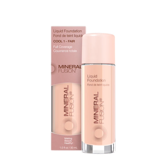 A pump bottle of liquid foundation branded 'Mineral Fusion' with its packaging box behind it. The foundation is displayed in a shade close to fair to medium skin tone range.