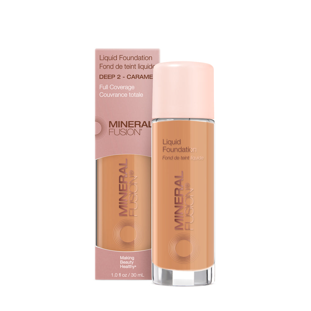 A pump bottle of liquid foundation branded 'Mineral Fusion' with its packaging box behind it. The foundation is displayed in a shade close to fair to medium skin tone range.