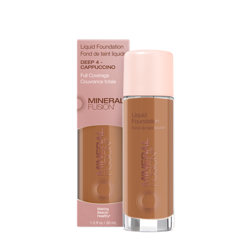 A pump bottle of liquid foundation branded 'Mineral Fusion' with its packaging box behind it. The foundation is displayed in a shade close to fair to medium skin tone range.