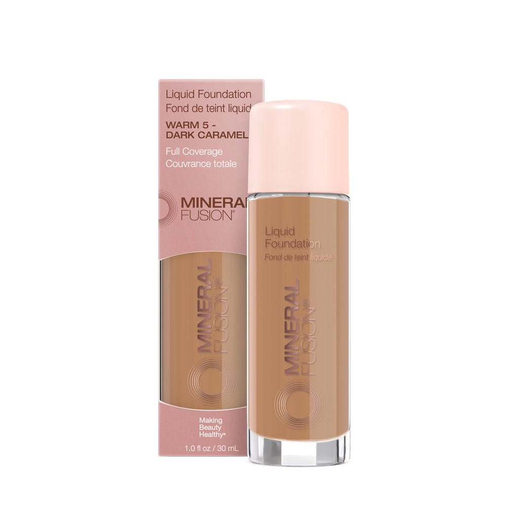 A pump bottle of liquid foundation branded 'Mineral Fusion' with its packaging box behind it. The foundation is displayed in a shade close to fair to medium skin tone range.